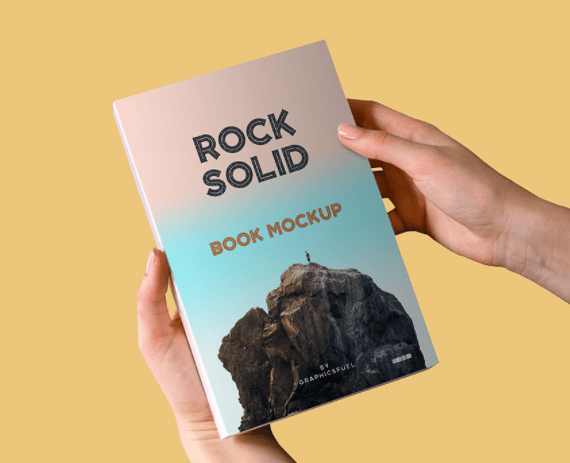 Paperback Book In Hand Mockup PSD